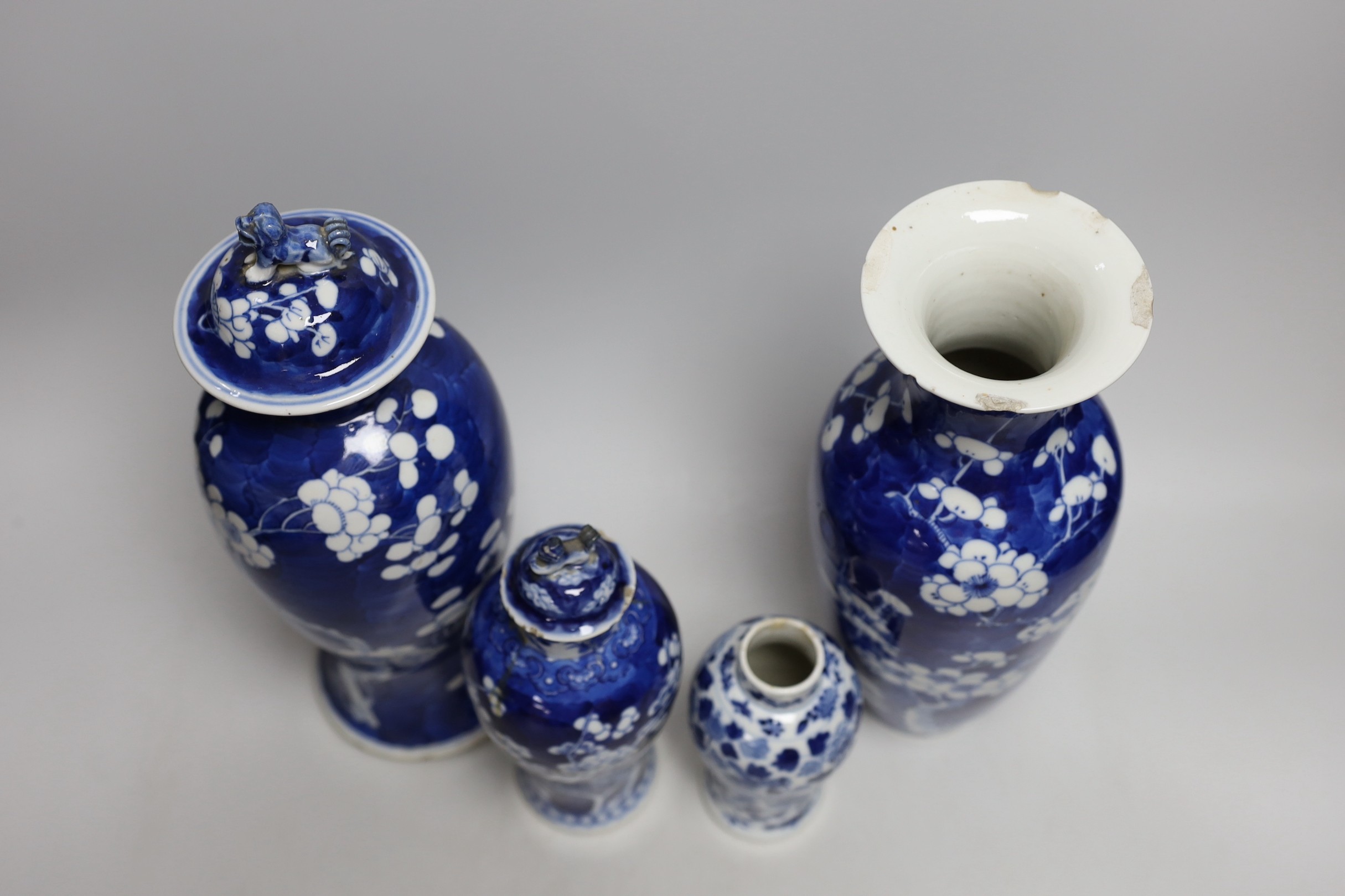 A Chinese prunus baluster jar and cover and three others, similar, tallest 30cms high